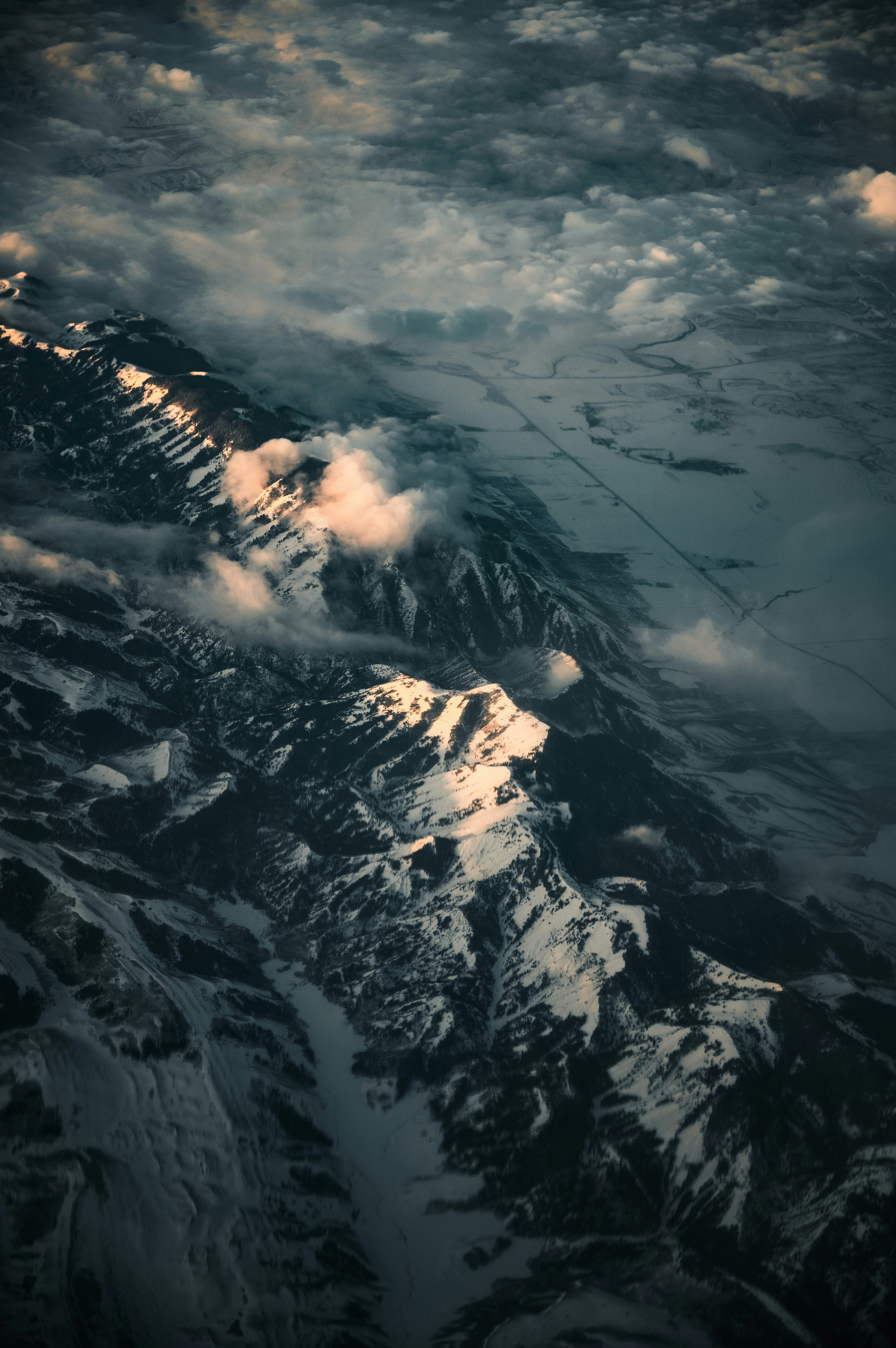 aerial view of snow covered mountains during daytime